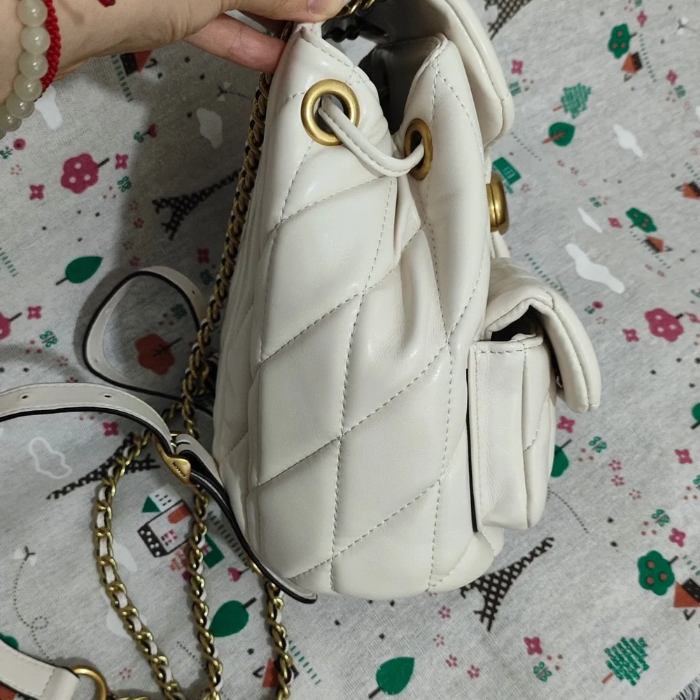 Coach Quilted Chalk Leather Drawstring Backpack with Gold Hardware